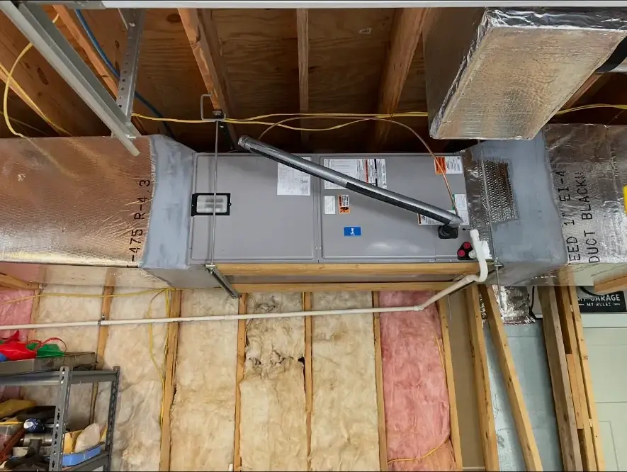 Horizontal HVAC air handler installed in an unfinished attic or utility area